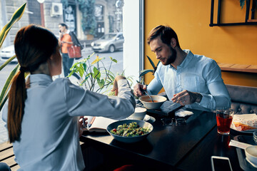 employees at the table in the cafe lunch break cooking women and man
