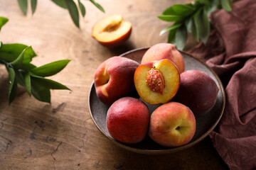 Naklejka na ściany i meble Fresh ripe peaches in a bowl