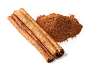 pile of cassia stick and cinnamon powder on white