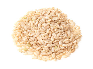 handful of polished brown rice closeup on white