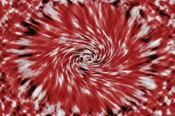 Abstract  tie-dye blend of red  glowing coloured images focused in a centre pattern.