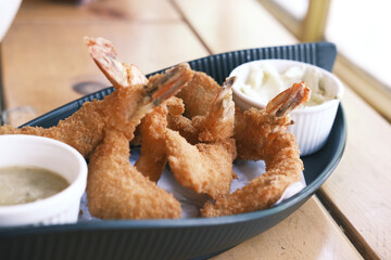 tasty fried king prawn in a plate on table 
