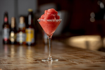Frozen margarita cocktail on wooden bar