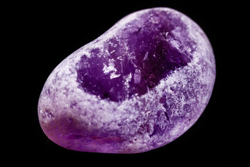Macro mineral amethyst on a black background