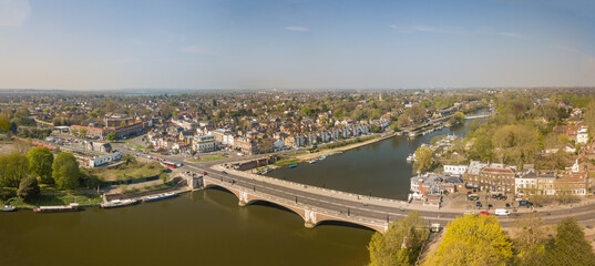 Fototapeta premium The drone aerial view of Hampton court bridge and East Molesey area in Greater London.
