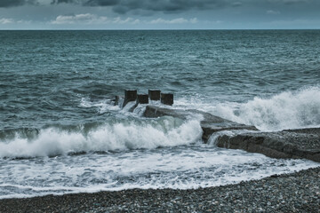 Stormy weather at the seaside. Big waves on the water