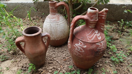 Big clay pot or jug standing on the dirty land in Cappadocia, Turkey