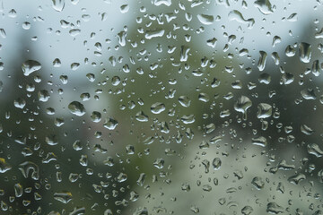 Raindrops on the window and wet surface