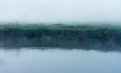 Obraz na płótnie Canvas foggy river shore