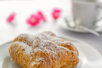 Close up of puff pastry with curd filling on a coffee table