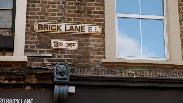 The street sign of Brick Lane, a street in East London, UK famous for its curry houses and the heart of the Bangladeshi community