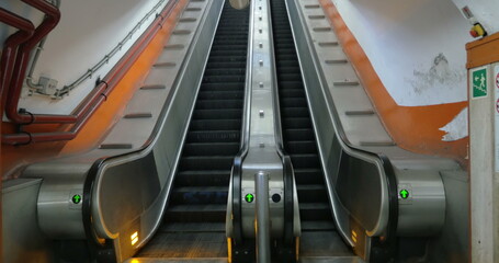 Empty underground escalator moving up