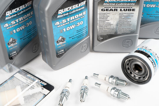Sankt-Petersburg, Russia, April 28, 2021: Maintenance kit for Mercury, Suzuki or Honda outboard engine. Set of Quicksilver spare parts for maintenance. Motorboat engine seasonal service