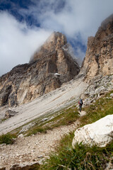Fototapeta premium man going up the mountains, italy, dolomites