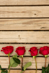 Obraz na płótnie Canvas roses on wood
