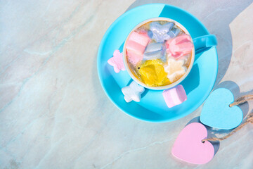 bright sunny morning with a cup of coffee and marshmallows flat lay