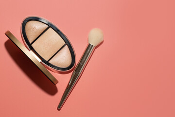 Pressed highlighter for face makeup with a brush