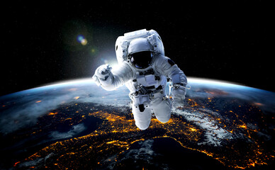 Astronaut spaceman do spacewalk while working for space station in outer space . Astronaut wear full spacesuit for space operation . Elements of this image furnished by NASA space astronaut photos. © InfiniteFlow
