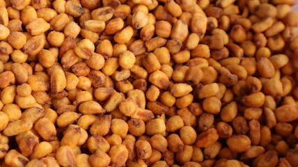Vegan healthy roasted corn nuts background. Organic sauced corn texture at the spice bazaar in Turkey