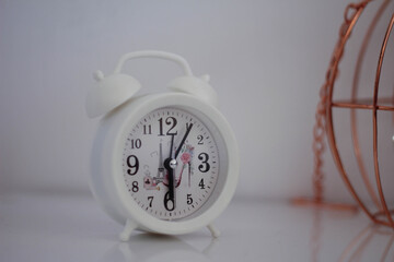 Classic white alarm clock for the bedroom