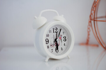 Classic white alarm clock for the bedroom