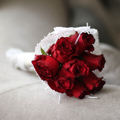 Bride Red flower bouquet in a white net