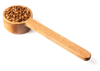 Barley Tea in the wooden spoon, isolated on pure white background