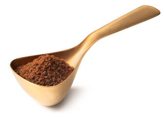 brown sugar in the measuring spoon, isolated on white background