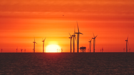 Offshore Wind Turbines with a rising sun