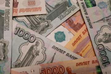 Fototapeta na wymiar Russian ruble banknotes issued by the Bank of Russia. Financial system and economy of Russia. World monetary system.