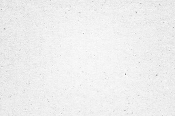 White paper or cardboard texture with black spot background.