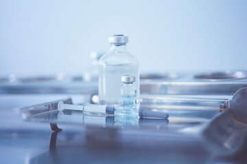 Trial vaccine coronavirus deverlopment vial dose flu shot drug needle syringe,medical concept...