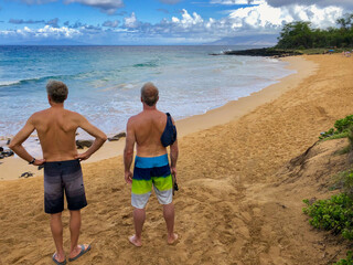 Hawaii with Pacific Ocean wake and surfer, surfer boys and people enjoying the tropical Paradise...