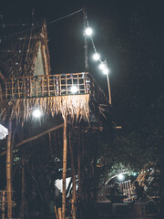 Thai hut turn on the lights at night near riverside
