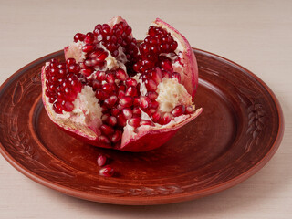 Still life of fresh fruit with pomegranate, grapes, pears and plums