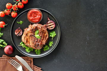 Grilled beef steak and tomato sauce on plate