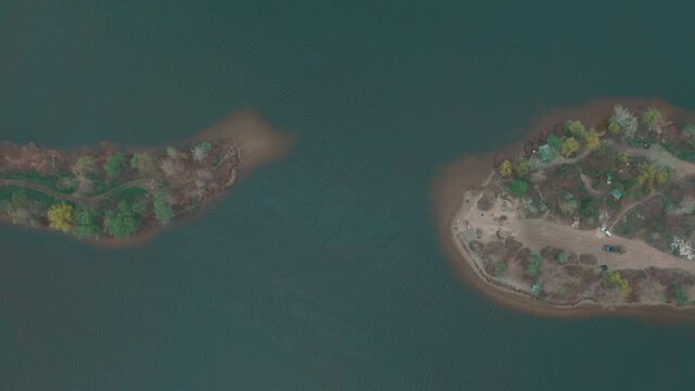 peninsula top view. two peninsulas near each other almost touch each other create a small bay at the mouth of the river. 4k aerial
