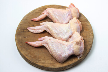 Raw chicken wings on a white background. Fresh chicken meat. Healthy diet © Ruzanna