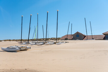 Yellow sandy beach in small Belgian town De Haan or Le Coq sur mer, luxury vacation destination, summer holidays