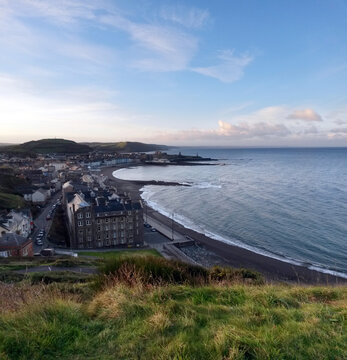 Early morning view from Constitution Hill Craig-glais towards Aberystwyth North Beach Traeth y Gogledd seafront and promenade in Ceredigion, West Wales, UK