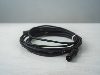 Black Cables against a White and Gray Surface