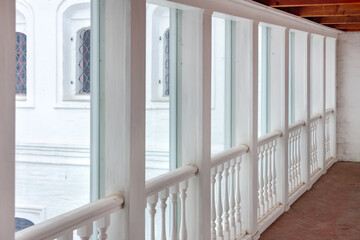 Empty long glass window hallway corridor in the public castle museum building. Connection walkway.