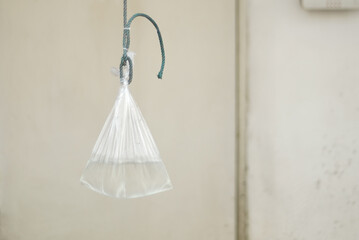 Close-Up a tote water bag to hang on a advertising cloth banners.