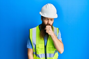 Redhead man with long beard wearing safety helmet and reflective jacket feeling unwell and coughing as symptom for cold or bronchitis. health care concept.