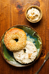 Sourdough sesame seed bagel with honey walnut fig cream cheese
