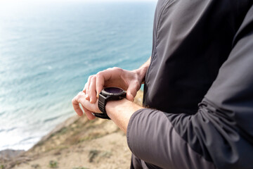 Hands with smart fitness watch close up