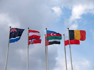 Various national flags countries under a blue sky