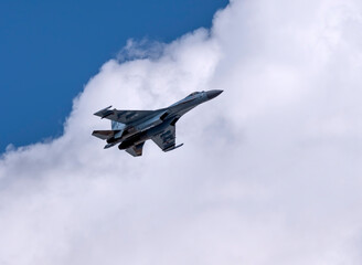 Naklejka na ściany i meble MOSCOW, RUSSIA - MAY 7, 2021: Avia parade in Moscow. jet fighter aircraft Su-35 in the sky on parade of Victory in World War II in Moscow, Russia