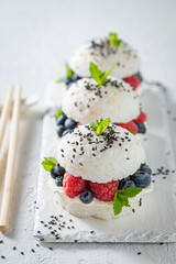 Unique sush burger with berries and sesame as Japanese dessert.