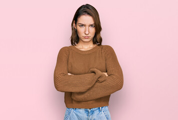 Young caucasian girl wearing casual clothes skeptic and nervous, disapproving expression on face with crossed arms. negative person.